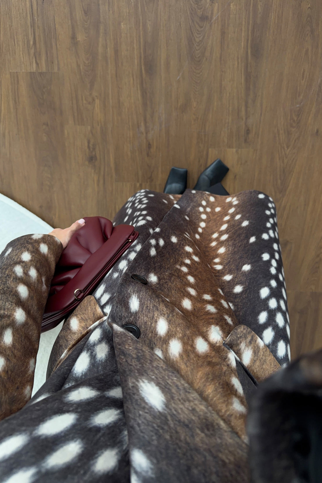 Bambi print long coat fabric and print closeup