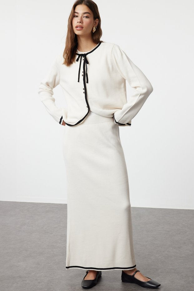 Ecru knit two-piece cardigan and maxi skirt front view