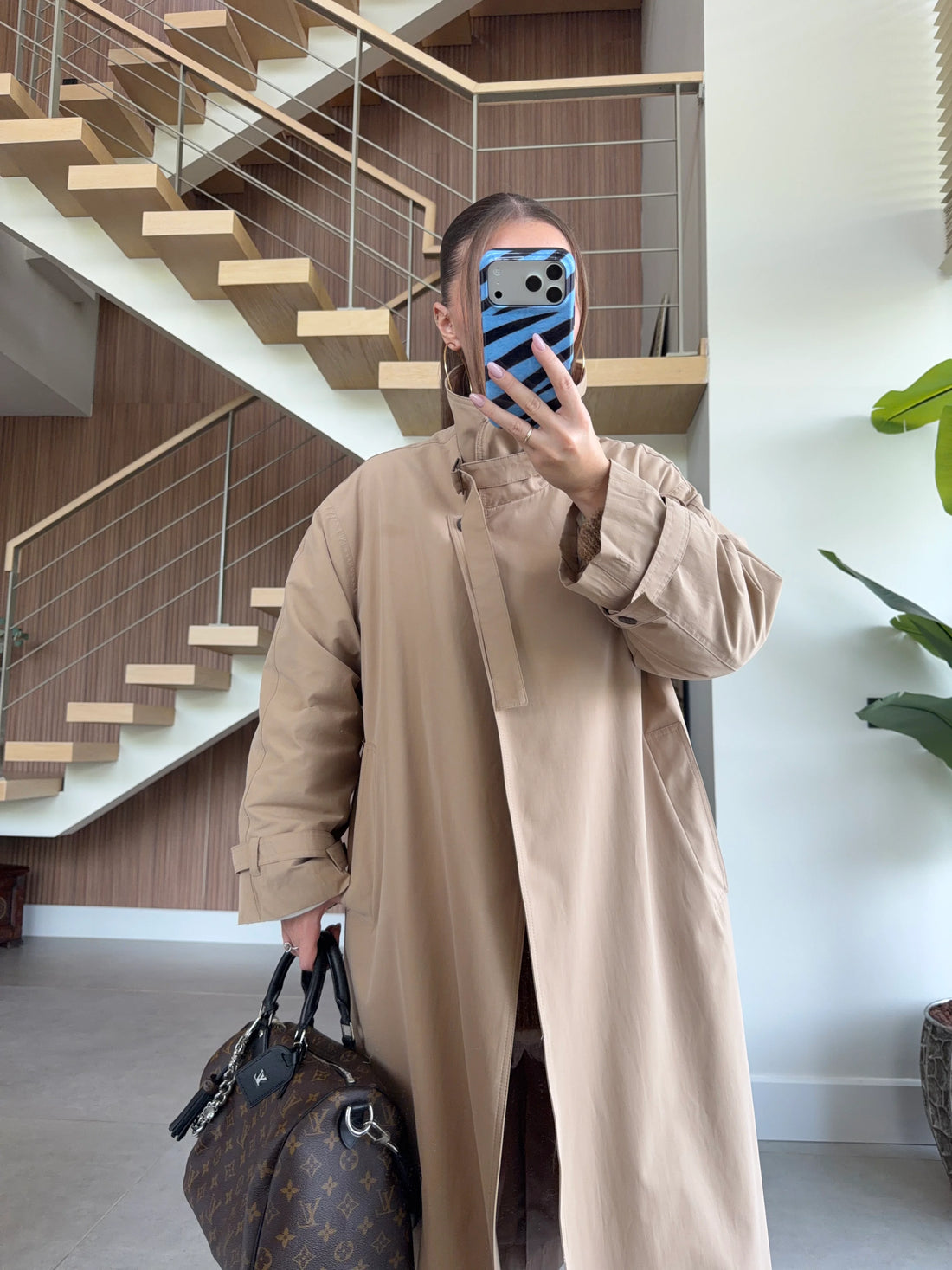 Camel trench coat detail