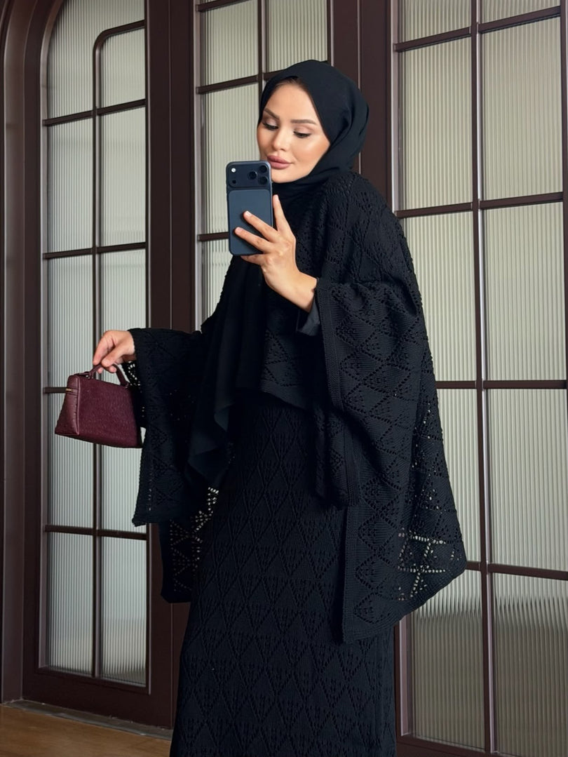 Black openwork knit poncho and maxi skirt three piece set – detail