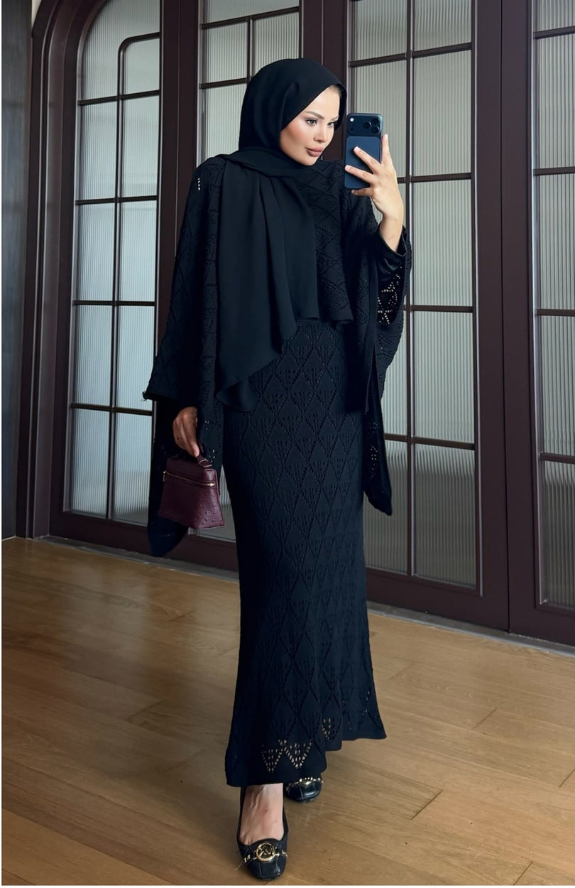 Black openwork knit poncho and maxi skirt three piece set – front