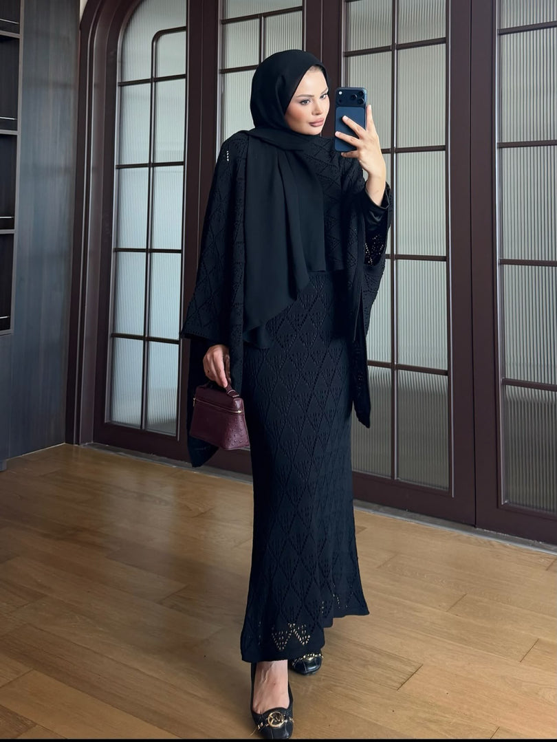 Black openwork knit poncho and maxi skirt three piece set – side