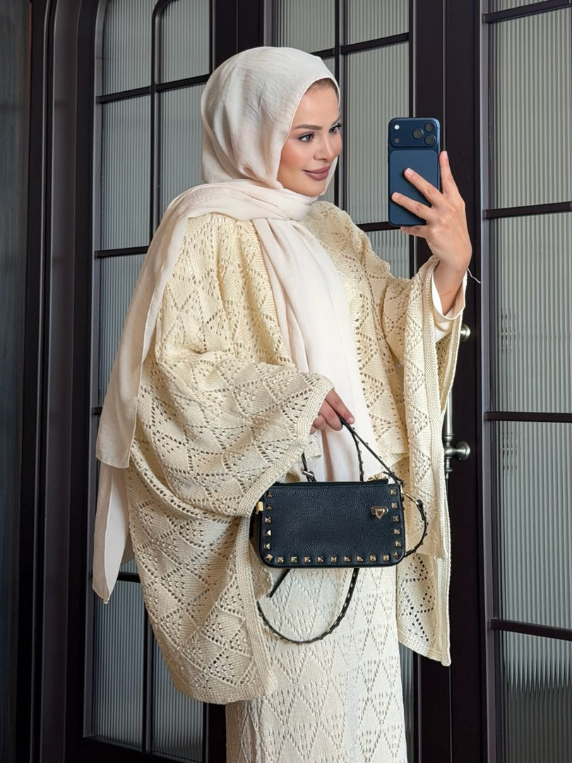 Cream openwork knit poncho and maxi skirt three piece set – texture