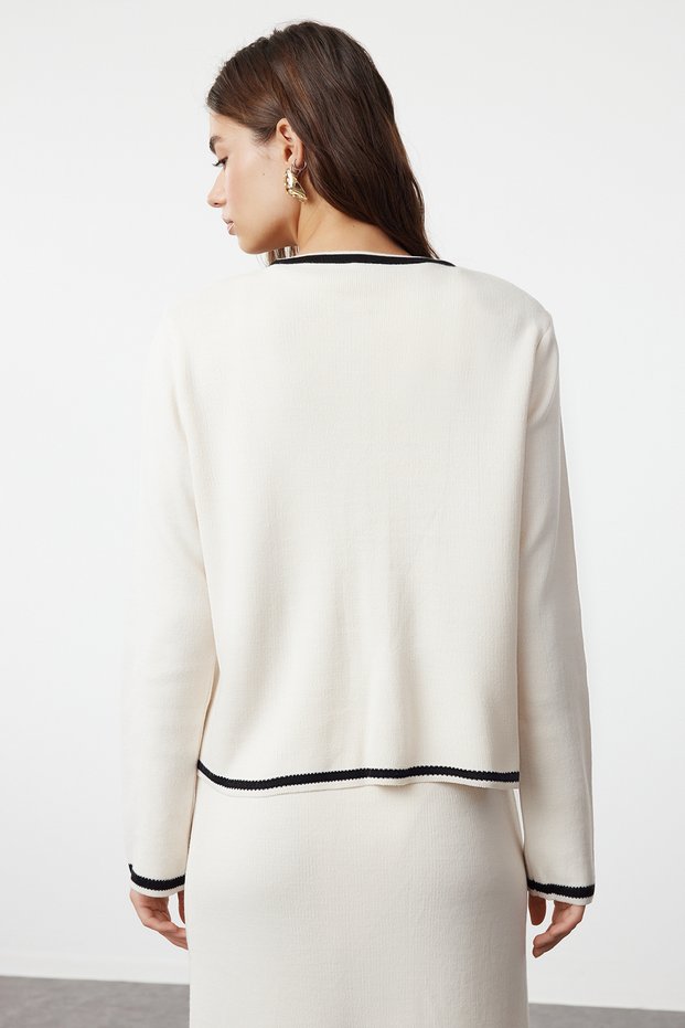 Back view of ecru knit cardigan and maxi skirt set